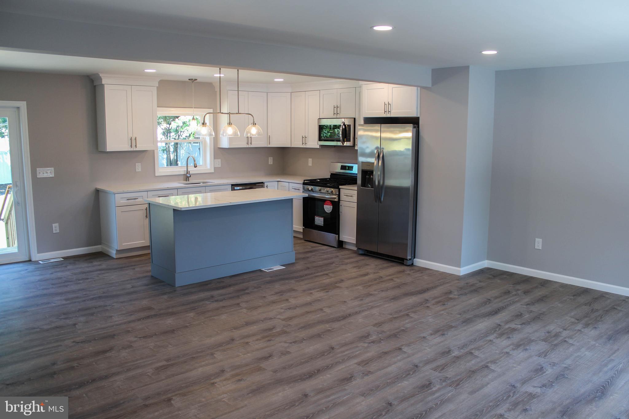 1402 Central Minotola, NJ 08341 - Photo 3 of 33 a kitchen with stainless steel appliances granite countertop a refrigerator and a stove top oven