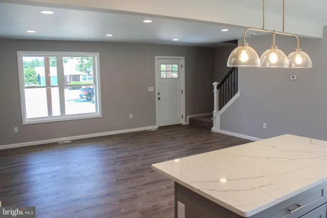 a view of a livingroom with furniture and wooden floor