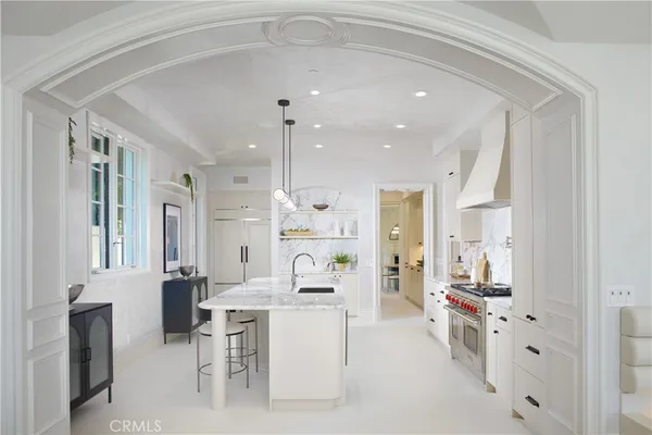 a bathroom with a granite countertop sink mirror and toilet