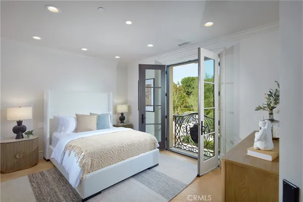 a bedroom with a large bed and a window