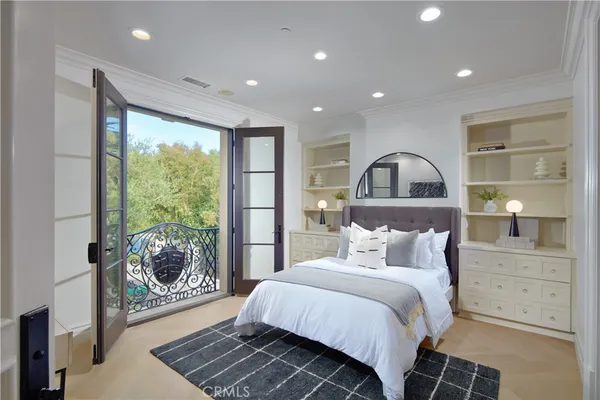 a living room with fireplace furniture and a view of kitchen