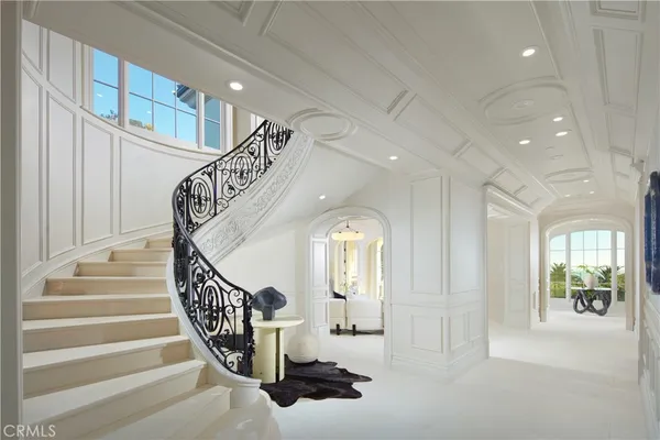 a view of entryway and hall with a front door