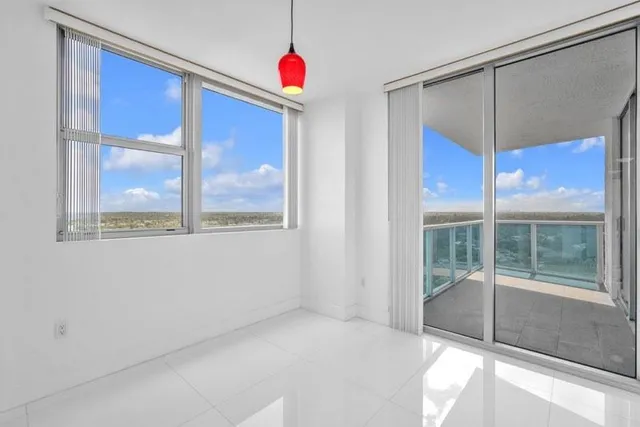 a view of an empty room with a window