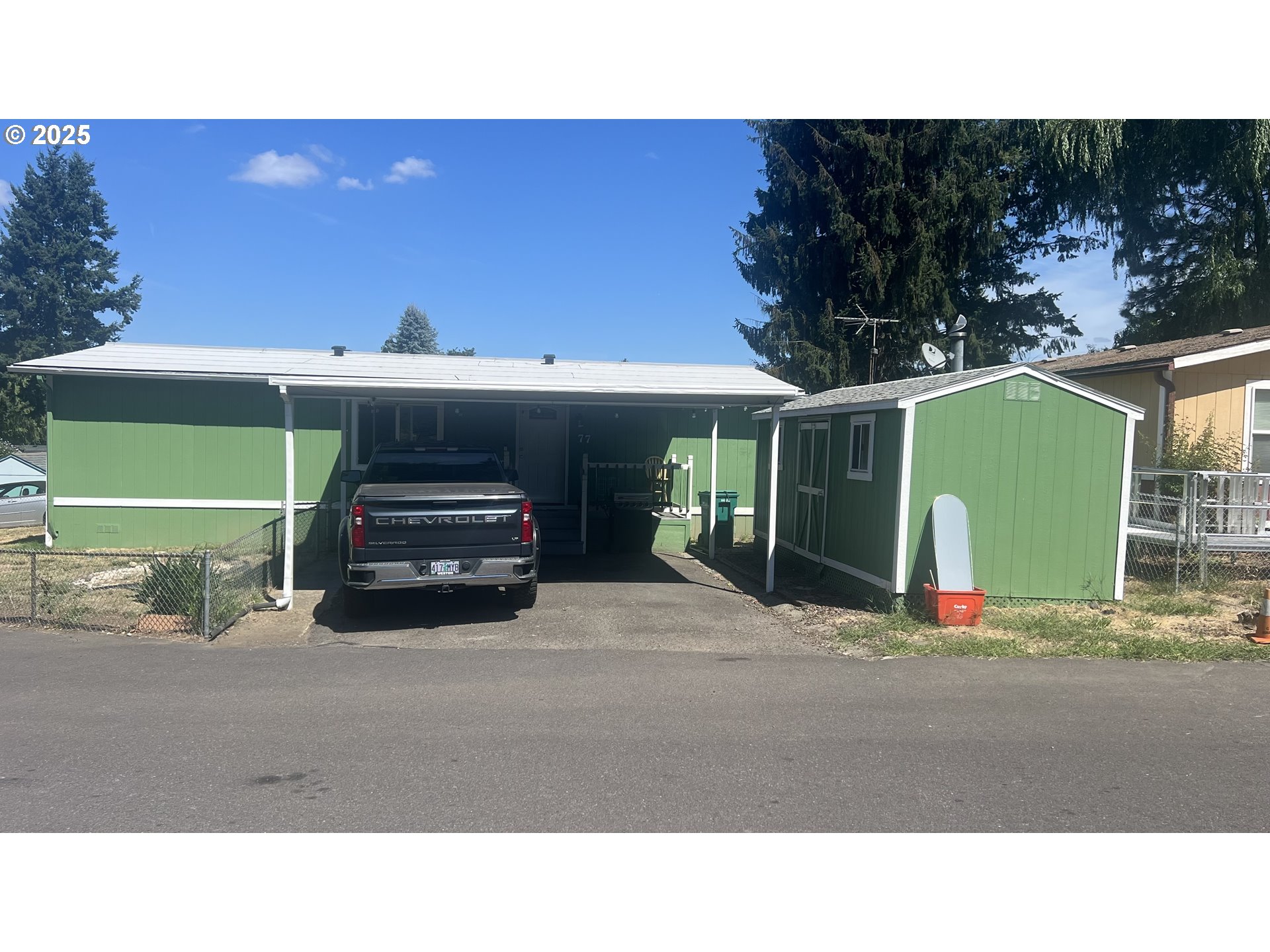 23200 Northeast Sandy Boulevard, Unit 77 Troutdale, OR 97060 - Photo 1 of 43 a black car parked in front of a building