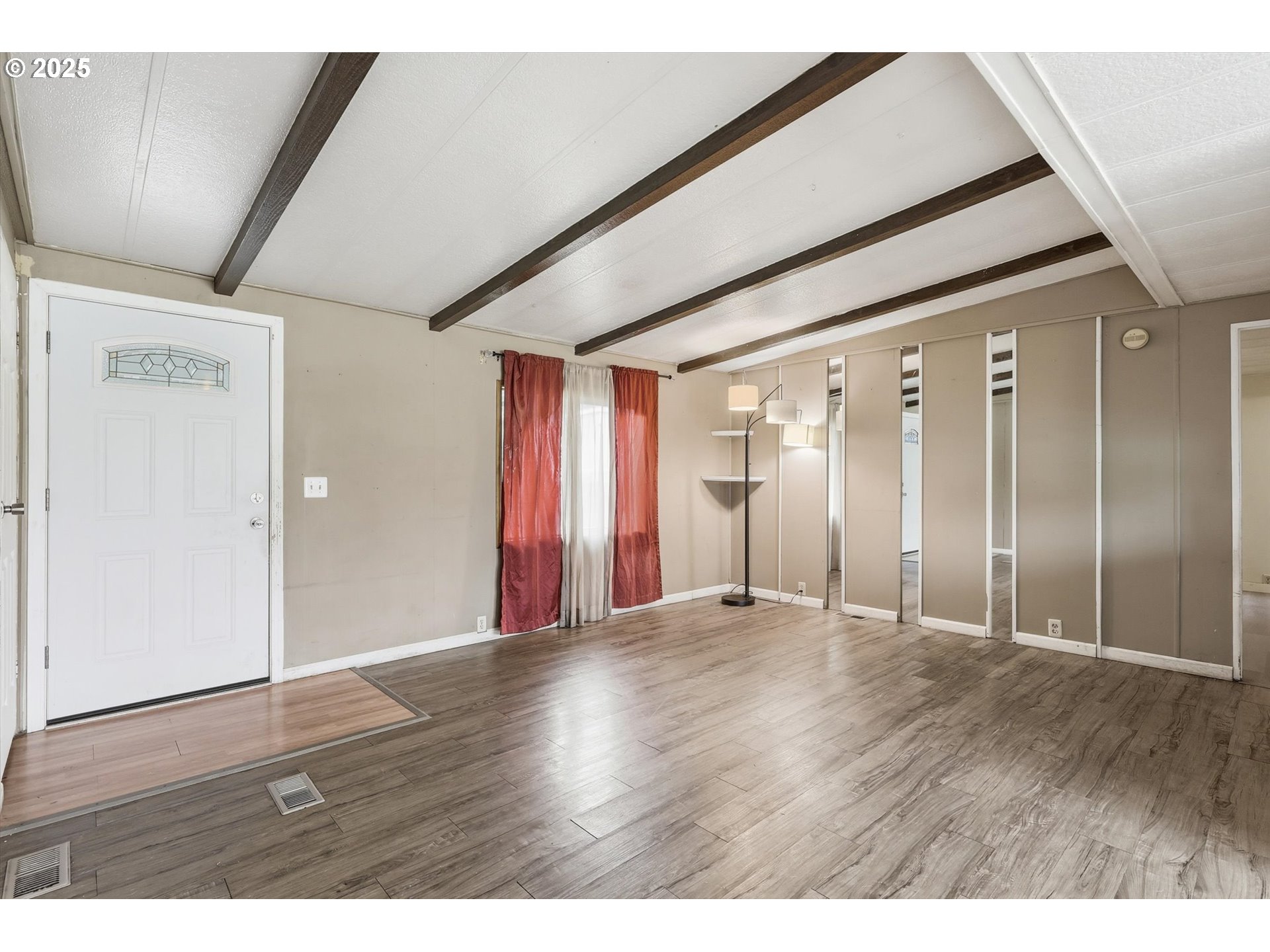 23200 Northeast Sandy Boulevard, Unit 77 Troutdale, OR 97060 - Photo 22 of 43 a view of an empty room with wooden floor