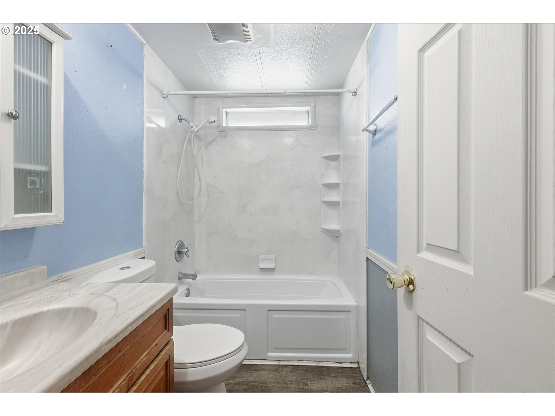 23200 Northeast Sandy Boulevard, Unit 77 Troutdale, OR 97060 - Photo 27 of 43 a bathroom with a granite countertop sink toilet and shower