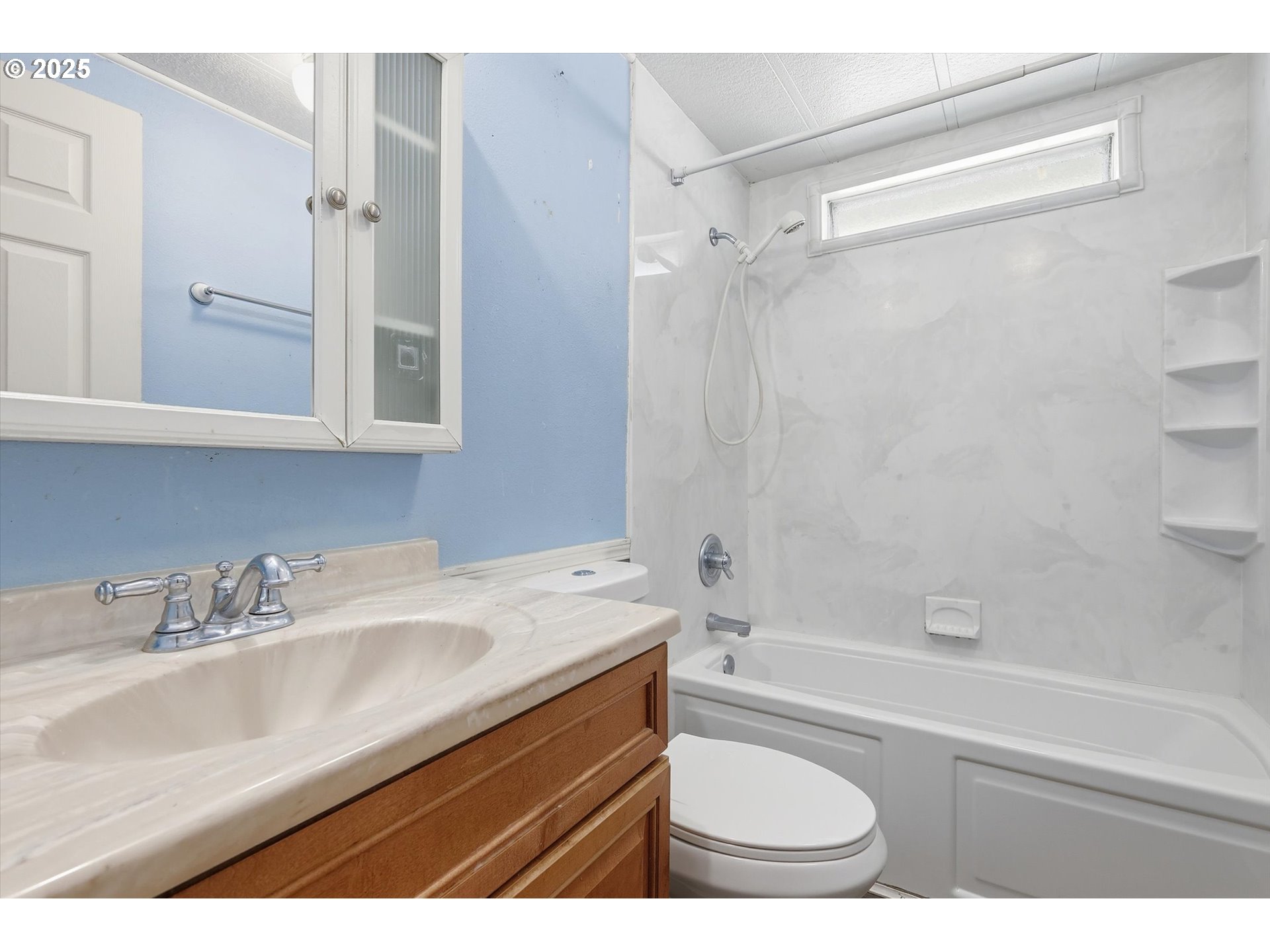 23200 Northeast Sandy Boulevard, Unit 77 Troutdale, OR 97060 - Photo 32 of 43 a bathroom with a sink a toilet and a bathtub
