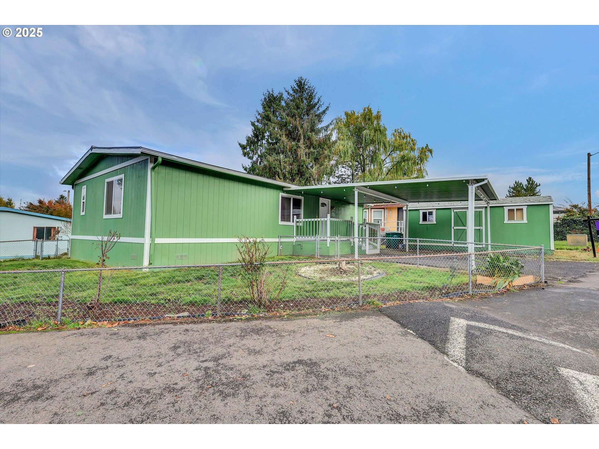 23200 Northeast Sandy Boulevard, Unit 77 Troutdale, OR 97060 - Photo 7 of 43 a view of a house with backyard and trees