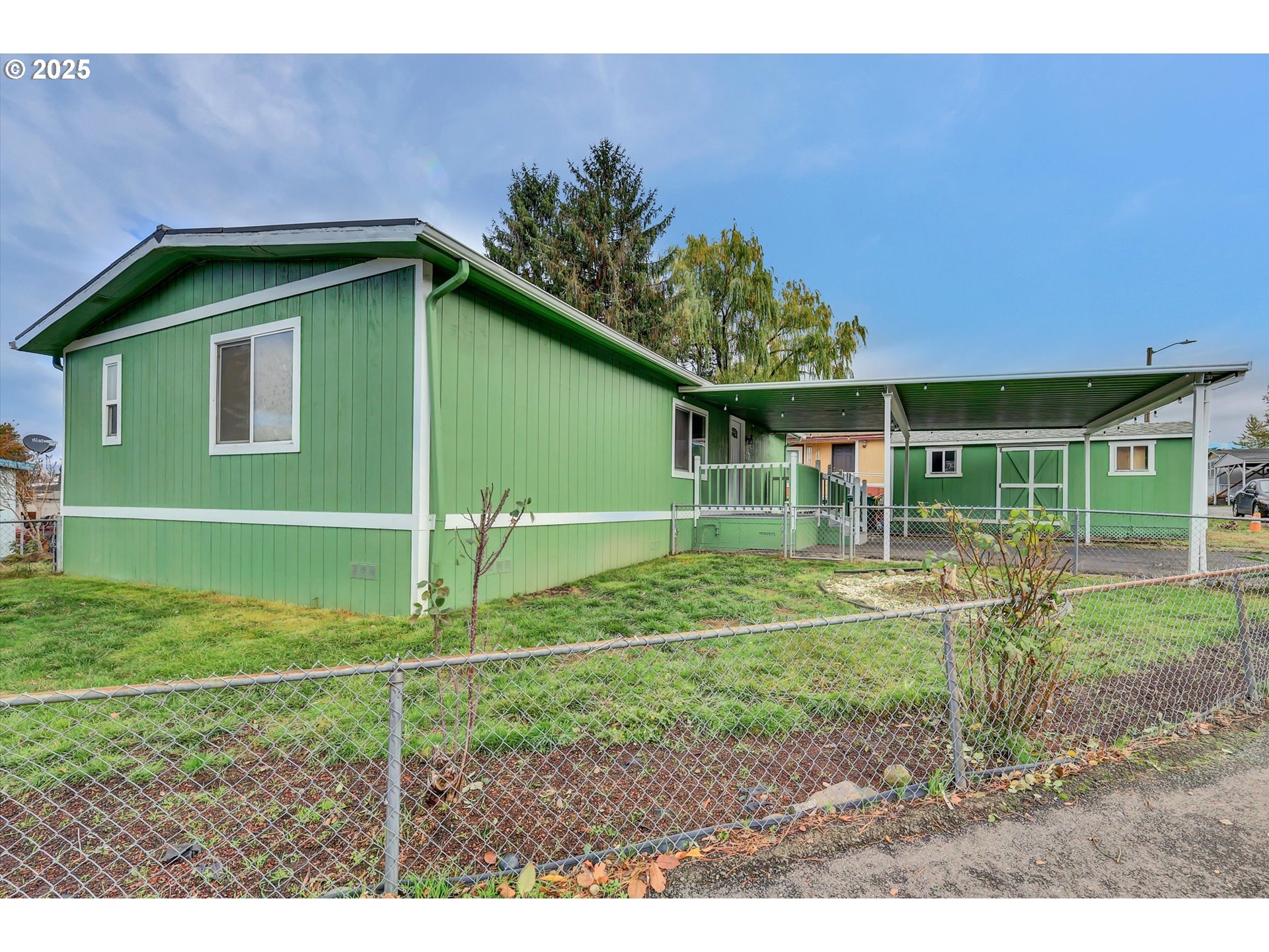 23200 Northeast Sandy Boulevard, Unit 77 Troutdale, OR 97060 - Photo 8 of 43 a view of a house with a yard