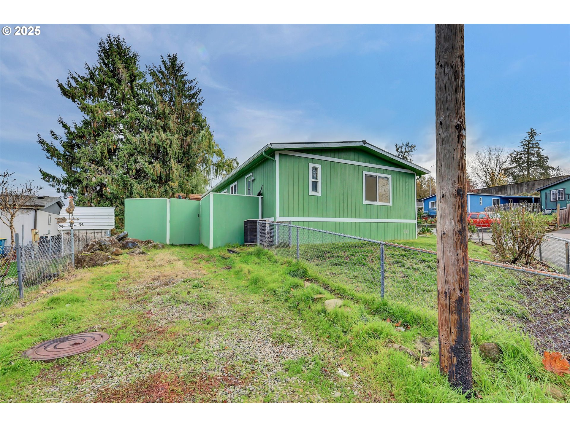 23200 Northeast Sandy Boulevard, Unit 77 Troutdale, OR 97060 - Photo 9 of 43 a green field with some trees in the background