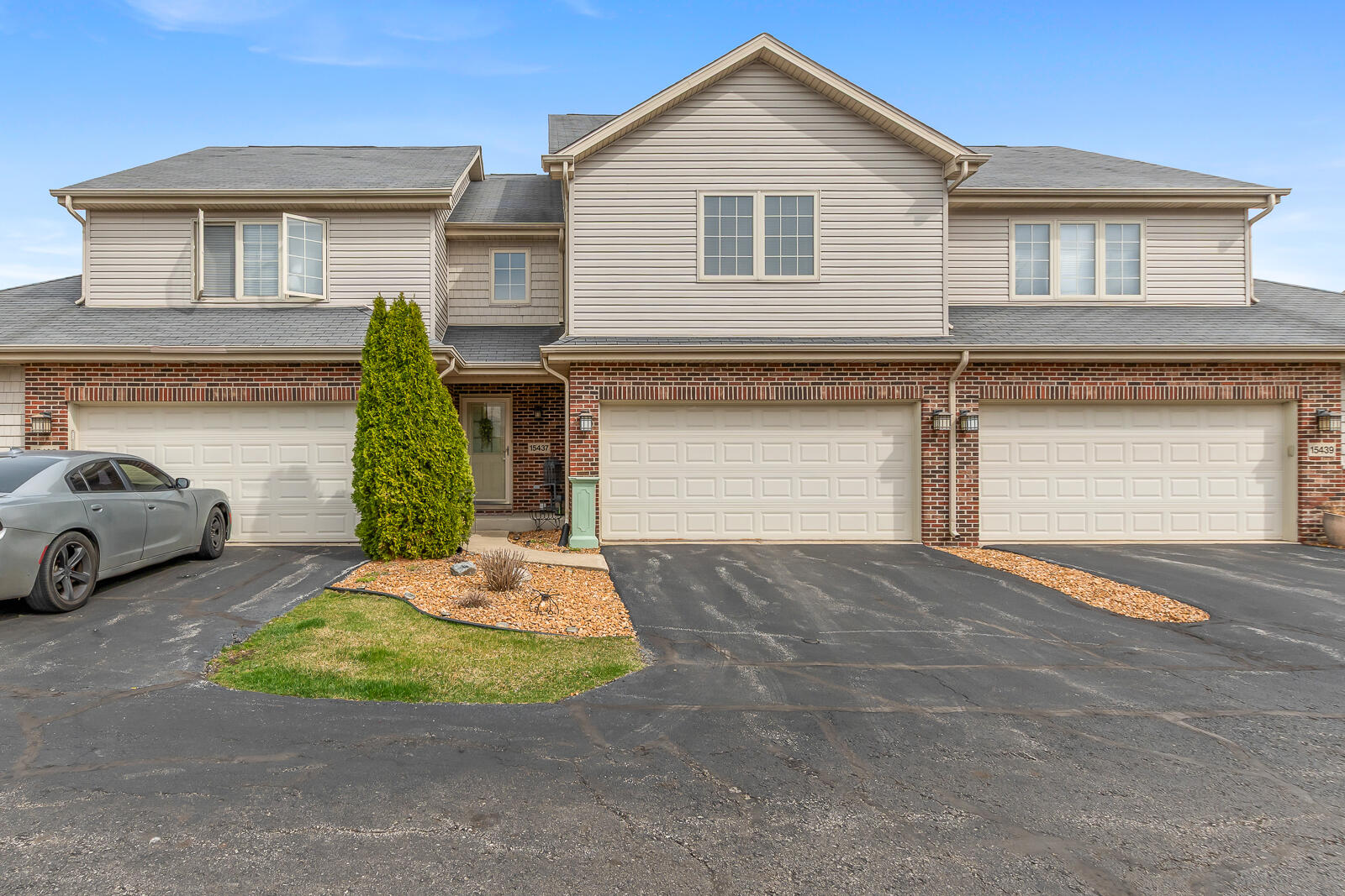 15437 98th Place Dyer, IN 46311 - Photo 1 of 19 a front view of a house with a yard and garage