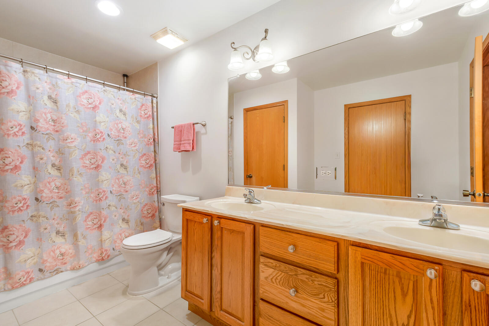 15437 98th Place Dyer, IN 46311 - Photo 11 of 19 a bathroom with a granite countertop sink a toilet a mirror a vanity and shower