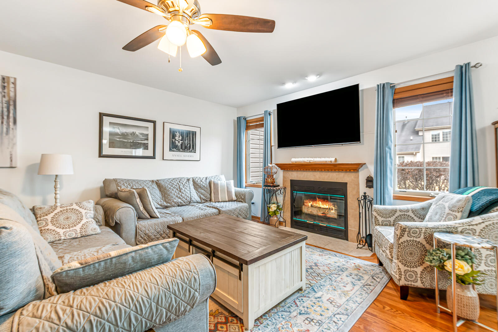 15437 98th Place Dyer, IN 46311 - Photo 3 of 19 a living room with furniture a flat screen tv and a fireplace