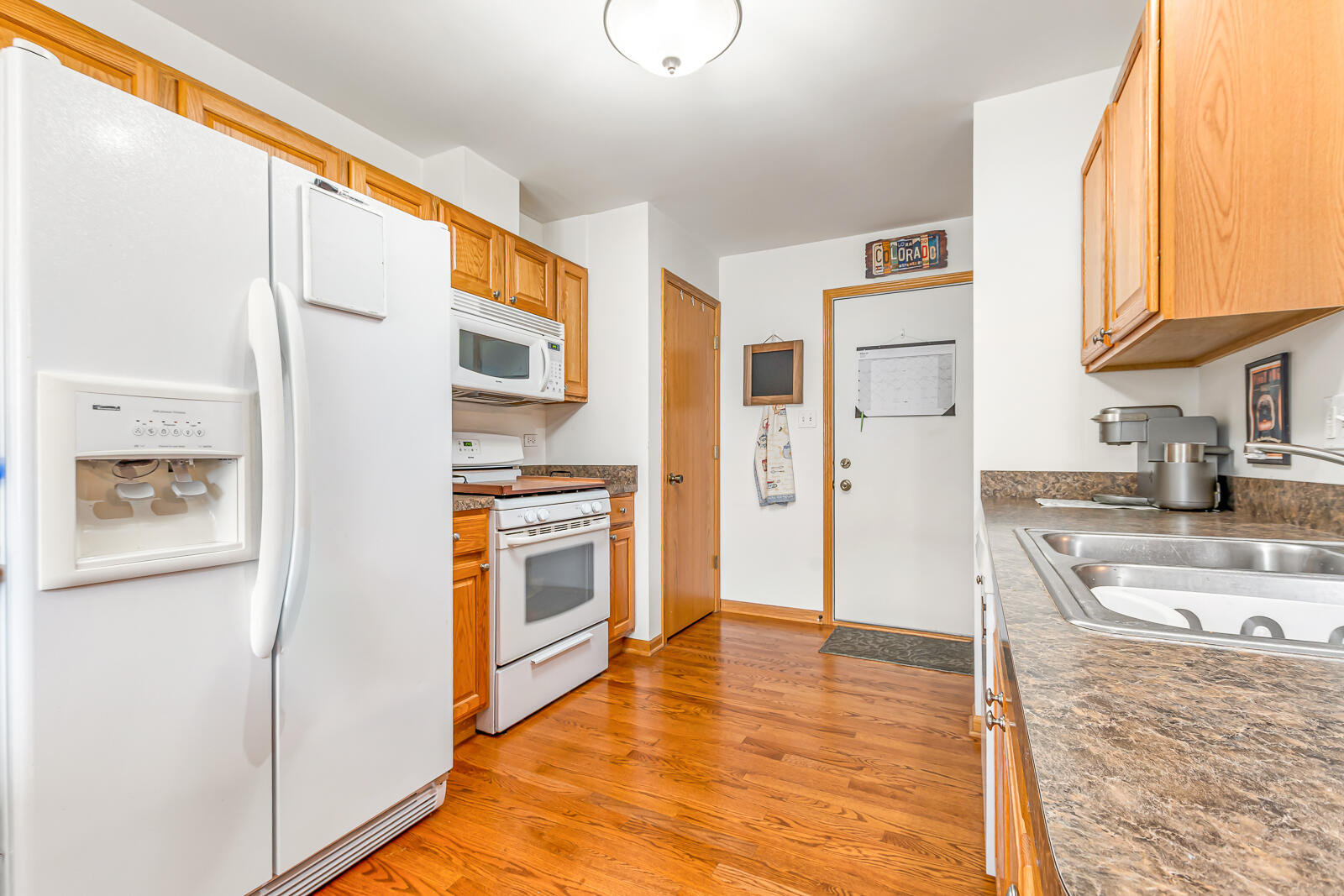 15437 98th Place Dyer, IN 46311 - Photo 5 of 19 a kitchen with stainless steel appliances granite countertop a refrigerator and a stove top oven