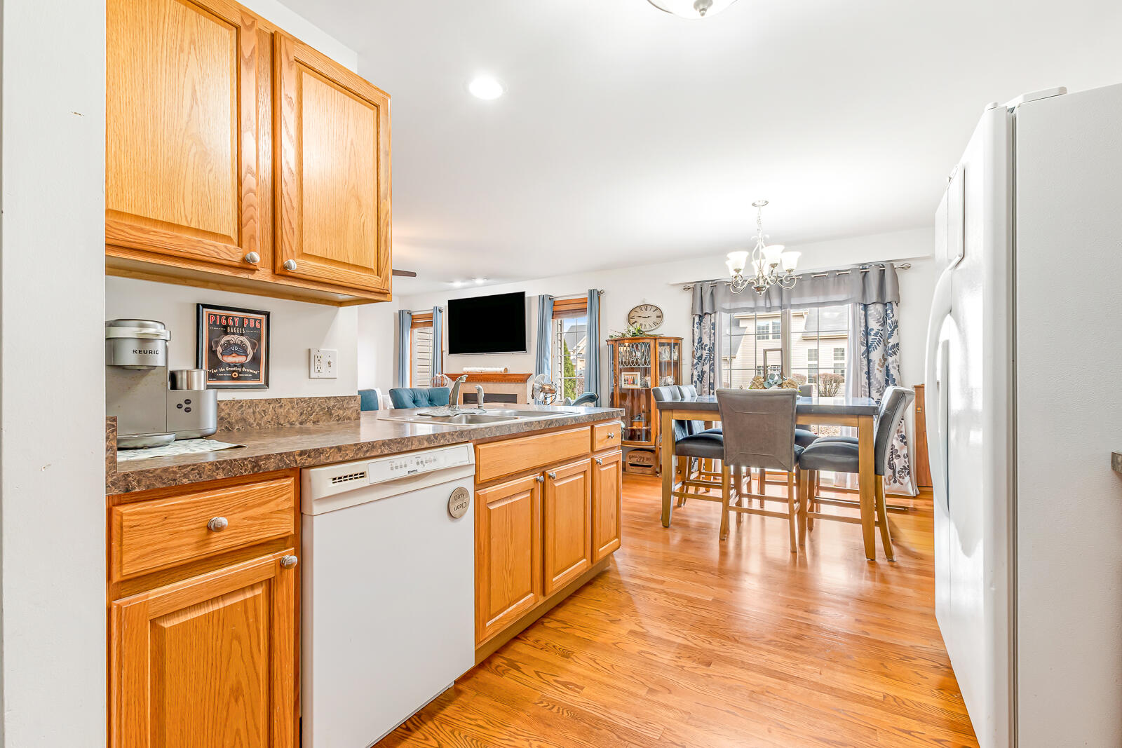 15437 98th Place Dyer, IN 46311 - Photo 6 of 19 a kitchen with stainless steel appliances granite countertop sink stove top oven and cabinets