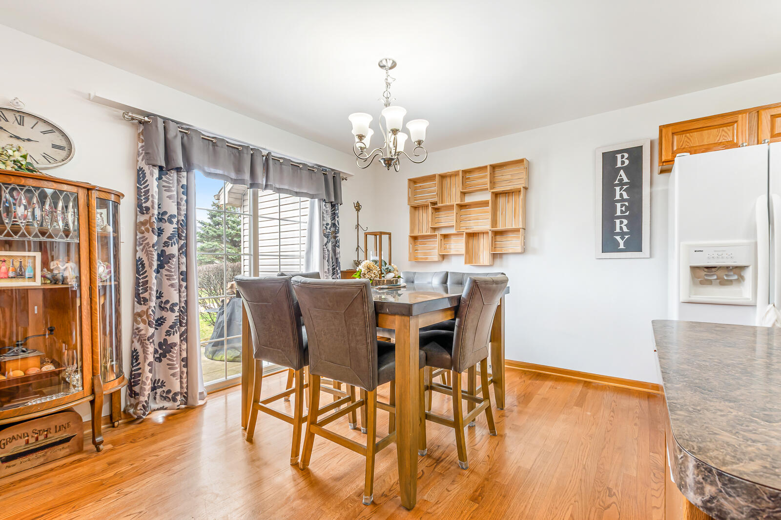 15437 98th Place Dyer, IN 46311 - Photo 7 of 19 a view of a dining room with furniture window and wooden floor