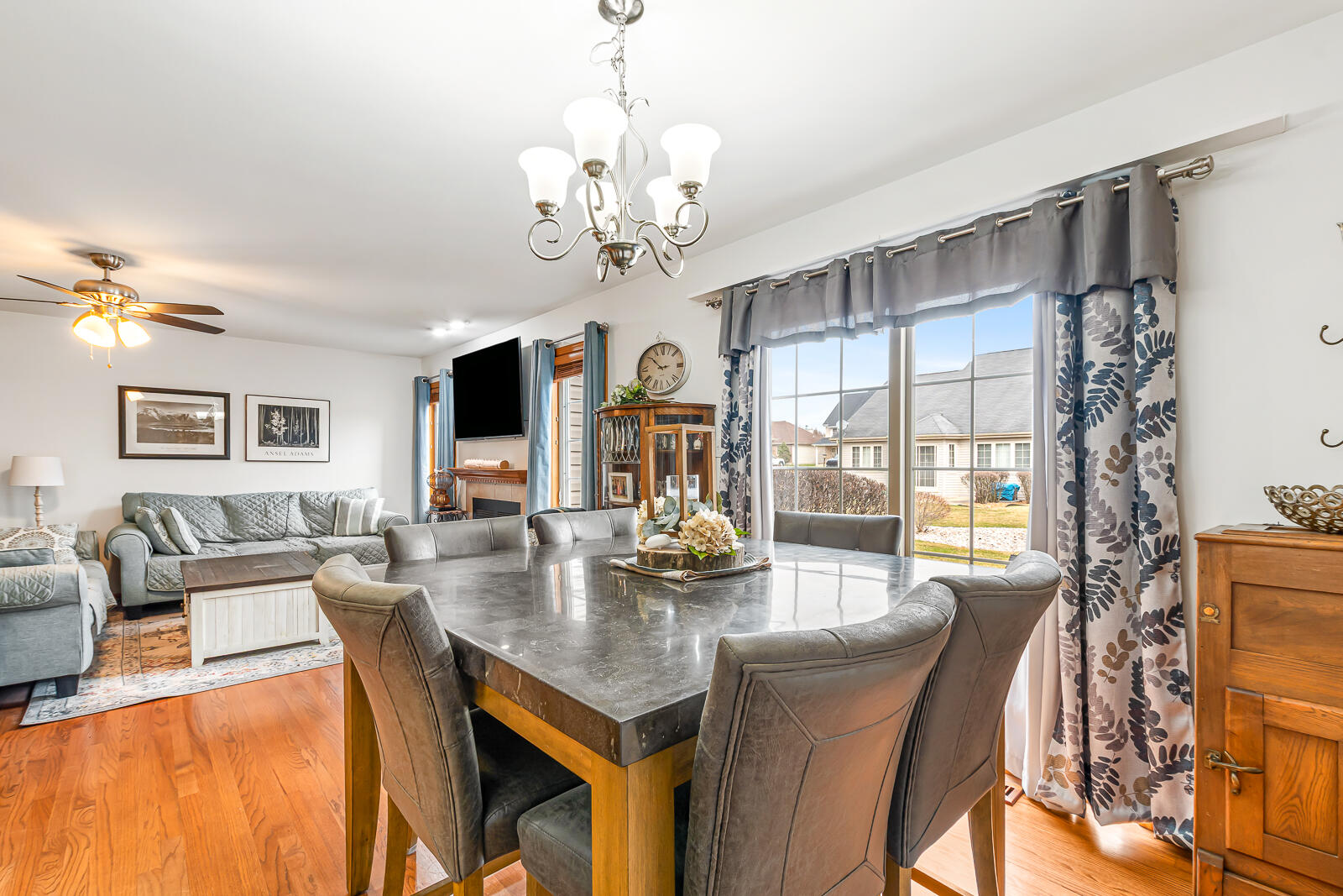 15437 98th Place Dyer, IN 46311 - Photo 8 of 19 a view of a dining room with furniture a chandelier and large windows