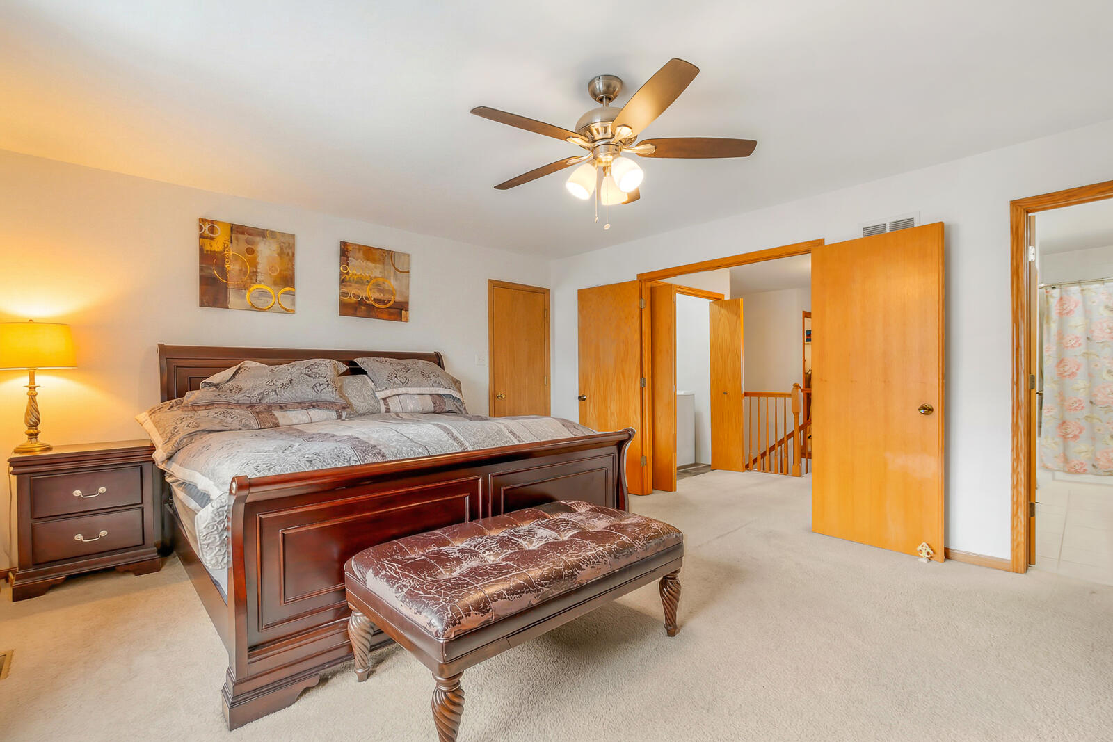 15437 98th Place Dyer, IN 46311 - Photo 9 of 19 a bedroom with a bed and a chandelier