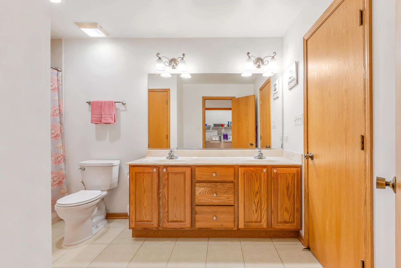 15437 98th Place Dyer, IN 46311 - Photo 10 of 19 a spacious bathroom with a granite countertop toilet sink and mirror