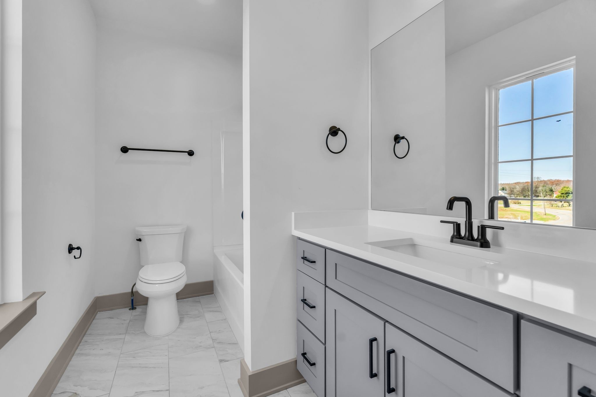 5414 Old Salem Road Rockvale, TN 37153 - Photo 31 of 34 a bathroom with a sink a toilet and a large mirror