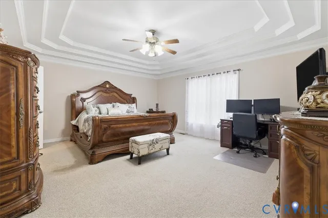a bedroom with furniture and a flat screen tv