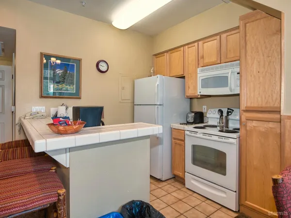a kitchen that has a stove and a microwave