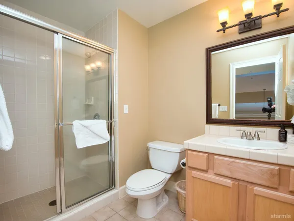 a bathroom with a toilet sink and shower