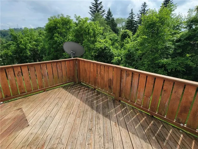 a view of outdoor space with deck and yard