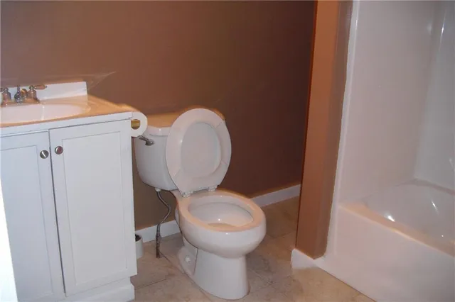 a bathroom with a toilet and a sink