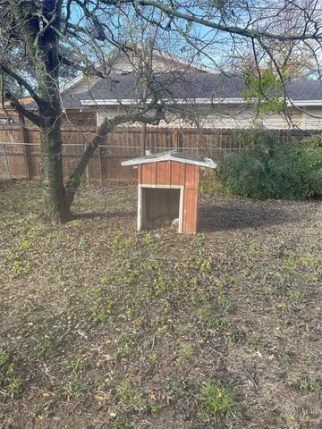 a view of a yard with a tiny house