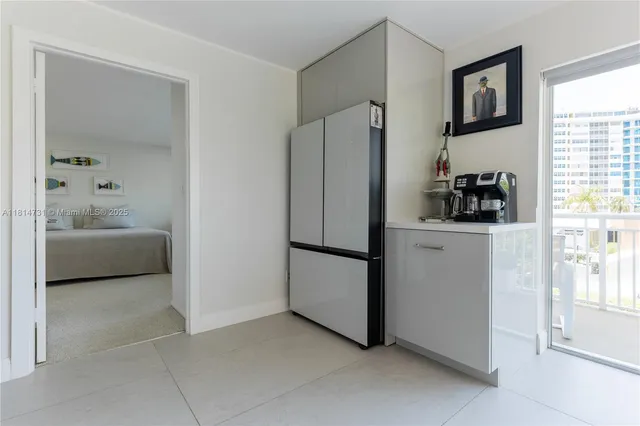 a kitchen with a refrigerator and a sink