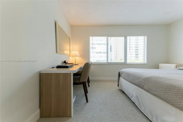 a bedroom with a bed and a cabinets