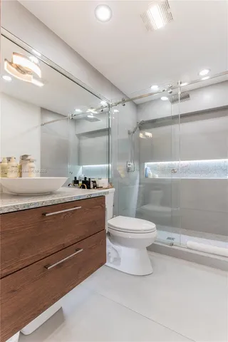 a spacious bathroom with a double vanity sink and a mirror