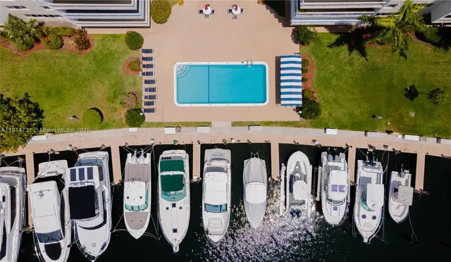 a view of swimming pool with outdoor seating and plants