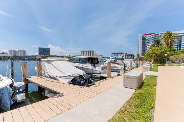 a swimming pool with outdoor seating and city view