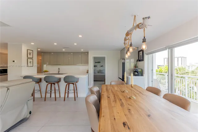 a large bedroom with a large bed and windows