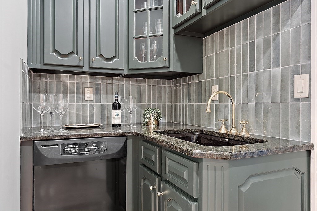 451 Wellesley Street Weston, MA 02493 - Photo 12 of 41 a kitchen with stainless steel appliances granite countertop a sink and cabinets
