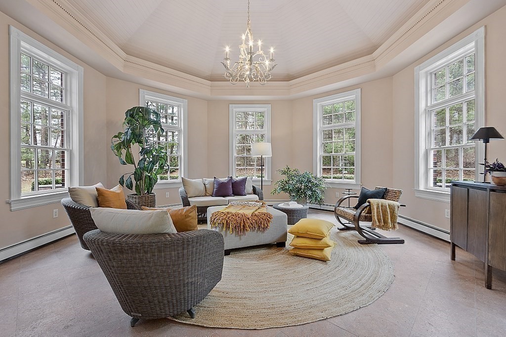 451 Wellesley Street Weston, MA 02493 - Photo 14 of 41 a living room with furniture and a chandelier
