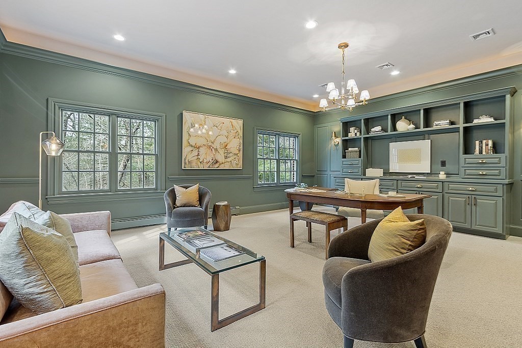 451 Wellesley Street Weston, MA 02493 - Photo 15 of 41 a living room with furniture a chandelier and a dining table
