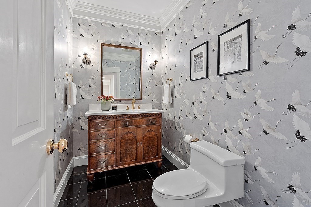 451 Wellesley Street Weston, MA 02493 - Photo 16 of 41 a bathroom with a granite countertop toilet sink and mirror