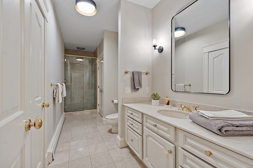 451 Wellesley Street Weston, MA 02493 - Photo 18 of 41 a spacious bathroom with a double vanity sink a mirror and a shower