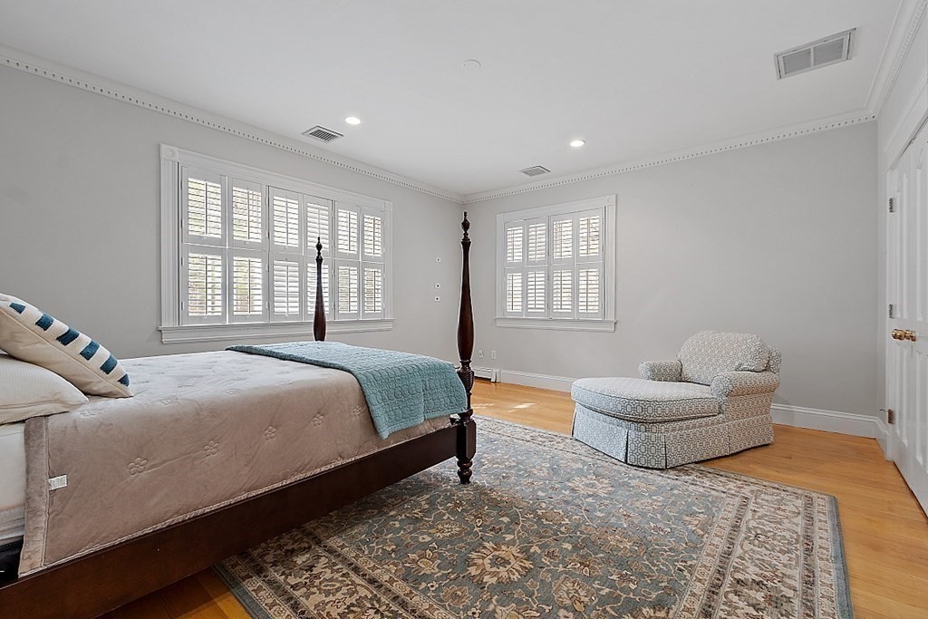 451 Wellesley Street Weston, MA 02493 - Photo 30 of 41 a bedroom with a bed and a couch