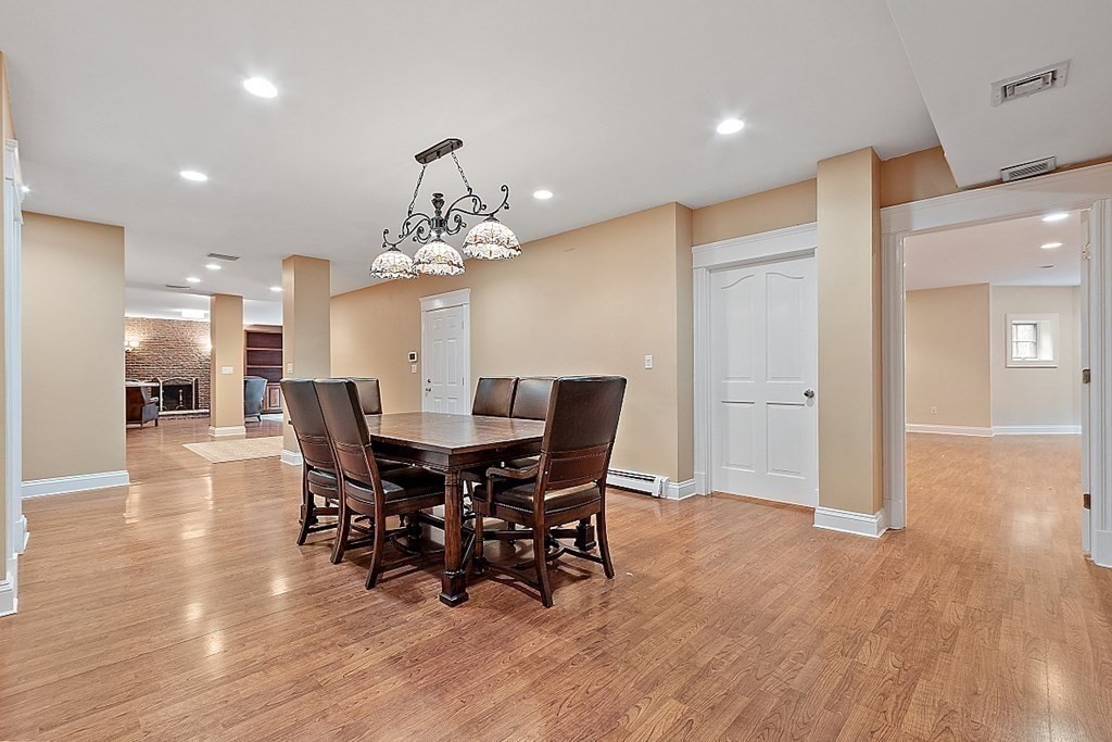451 Wellesley Street Weston, MA 02493 - Photo 33 of 41 a view of a dining room with furniture and wooden floor