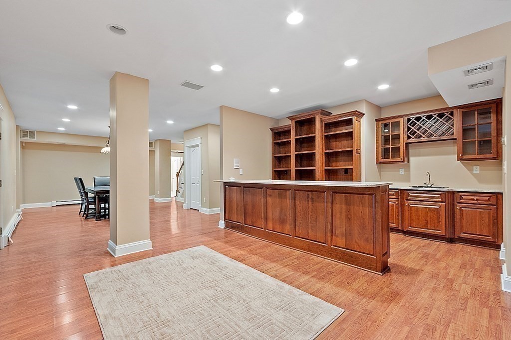451 Wellesley Street Weston, MA 02493 - Photo 34 of 41 a view of a kitchen with furniture and a wooden floor