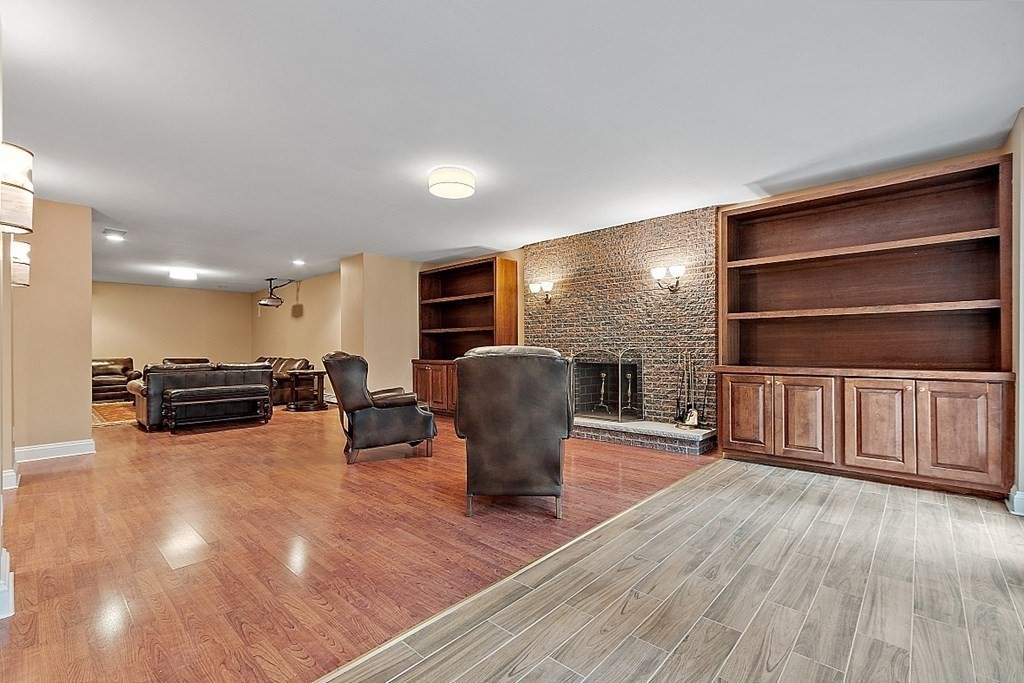 451 Wellesley Street Weston, MA 02493 - Photo 36 of 41 a view of a room with wooden floor furniture and windows