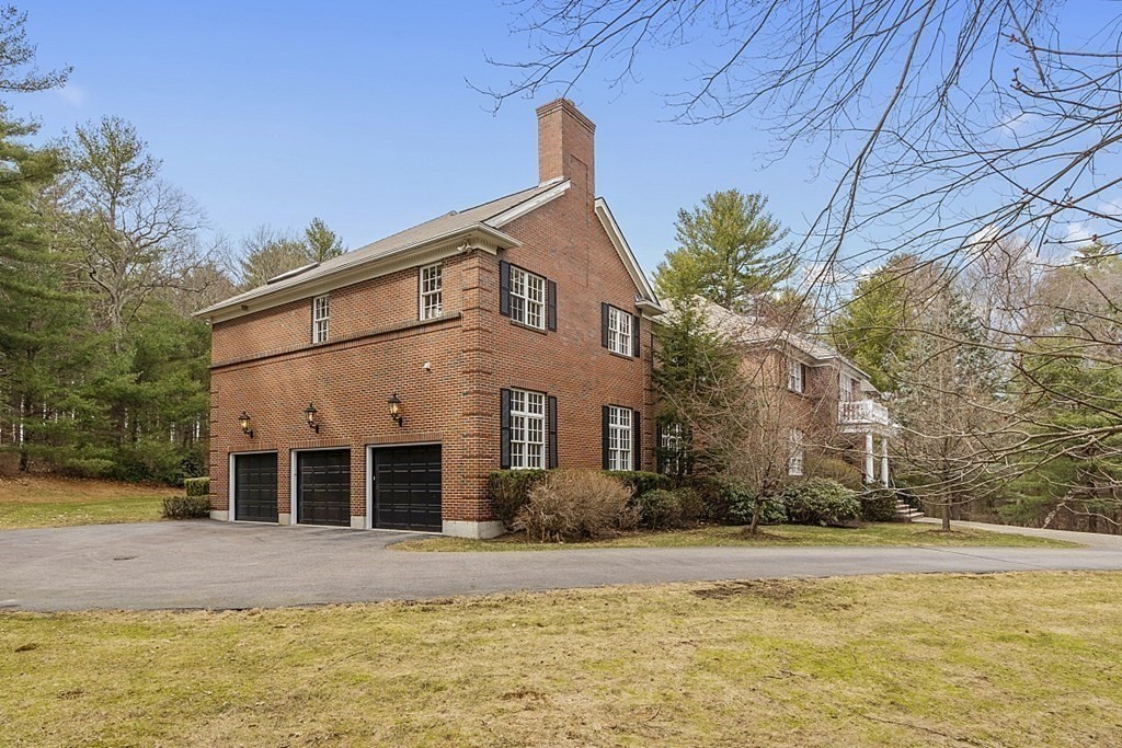 451 Wellesley Street Weston, MA 02493 - Photo 39 of 41 a view of a house with a yard and large tree