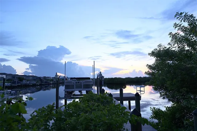 a view of a lake with a house in the background