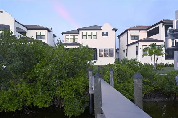 a view of a large building next to a yard