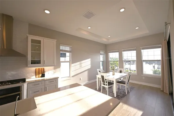 a kitchen with a table and chairs in it