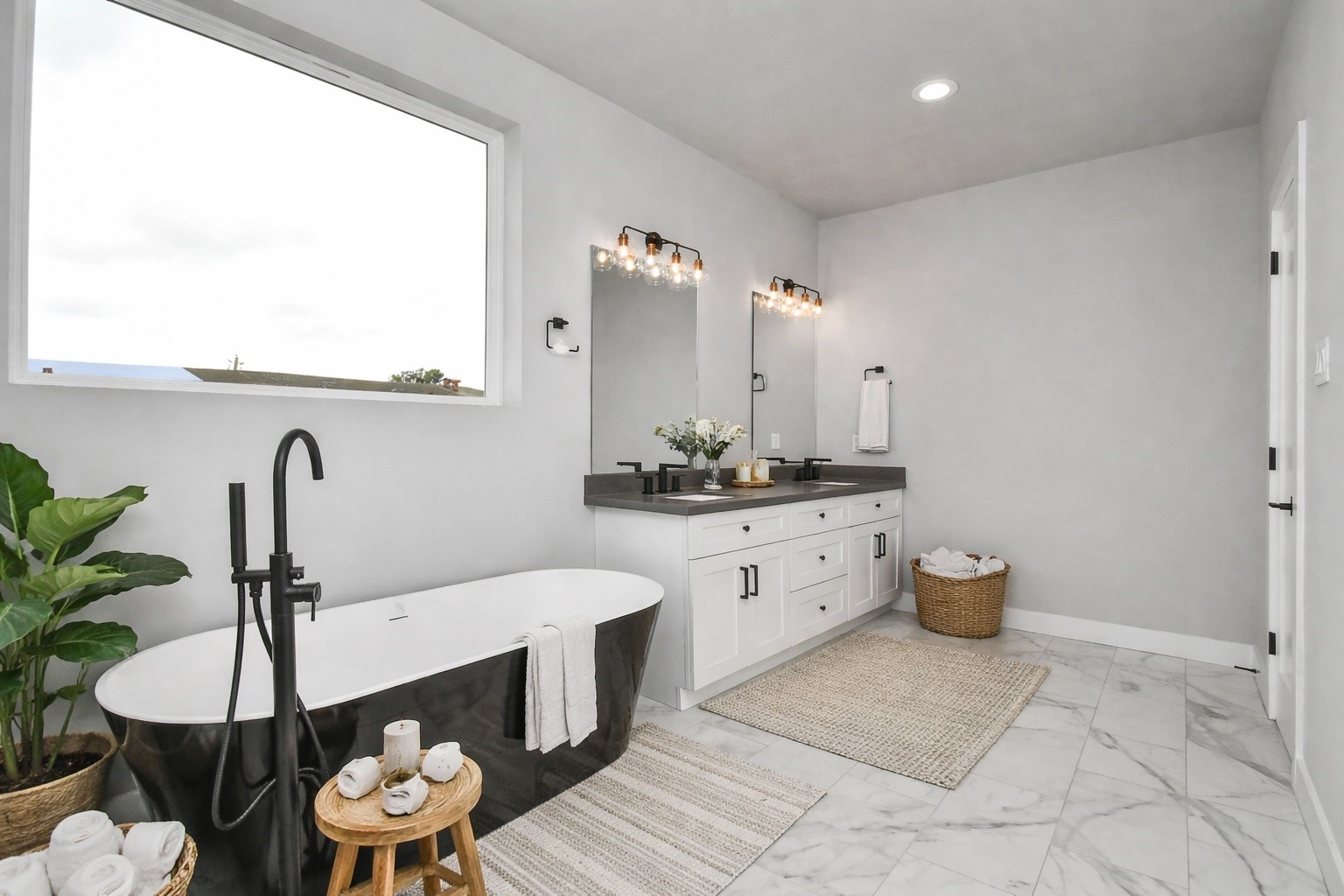 6817 Peerless Street Houston, TX 77021 - Photo 1 of 31 a bathroom with a double vanity sink and a mirror